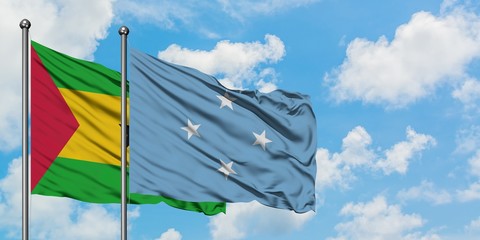 Sao Tome And Principe and Micronesia flag waving in the wind against white cloudy blue sky together. Diplomacy concept, international relations.