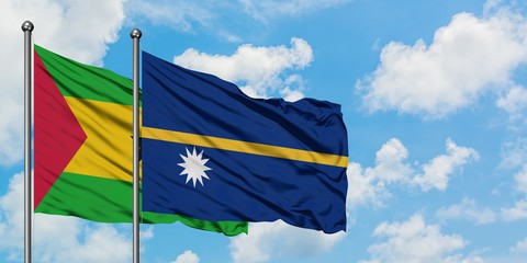 Sao Tome And Principe and Nauru flag waving in the wind against white cloudy blue sky together. Diplomacy concept, international relations.