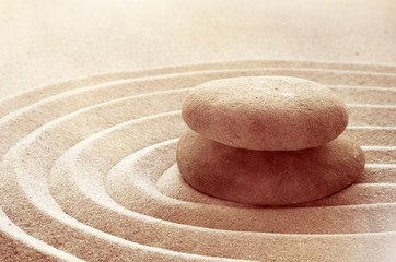 zen garden meditation stone background with stones and lines in sand for relaxation balance and...