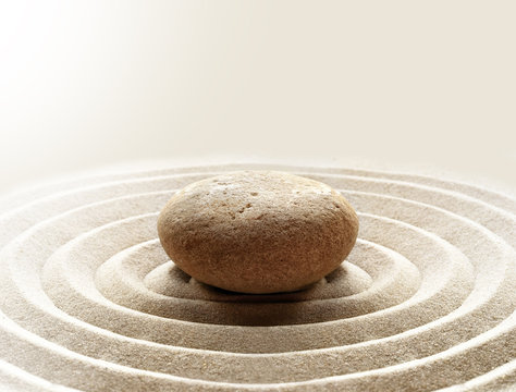 zen garden meditation stone background with stones and lines in sand for relaxation balance and harmony spirituality or spa wellness