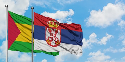 Sao Tome And Principe and Serbia flag waving in the wind against white cloudy blue sky together. Diplomacy concept, international relations.