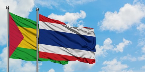 Sao Tome And Principe and Thailand flag waving in the wind against white cloudy blue sky together. Diplomacy concept, international relations.