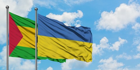 Sao Tome And Principe and Ukraine flag waving in the wind against white cloudy blue sky together. Diplomacy concept, international relations.