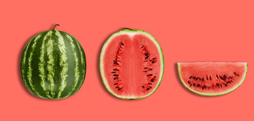 Green, striped watermelon, pink background with copy space for text, images. Cross-section. Berry with red flesh, black seeds. Top view. Close-up.