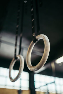 Wooden gymnastic rings in a gym