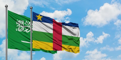 Saudi Arabia and Central African Republic flag waving in the wind against white cloudy blue sky together. Diplomacy concept, international relations.