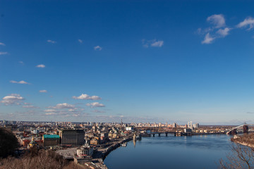 View of the metropolis from a height. City of Kiev, Ukraine. The Dnieper River flowing through the center of Kiev.