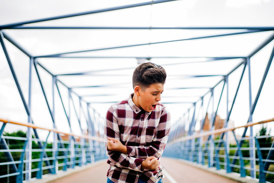 Gypsy boy singing flamenco on a bridge