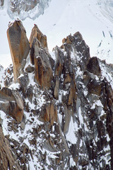 Two climbers on a huge stone rock in the Mont Blanc massif. Alps, France.