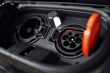 Charging inputs of brand new electrical car. Modern fuel. Conception of ecology