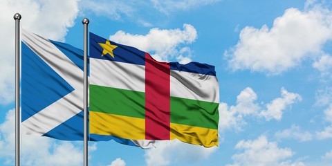 Scotland and Central African Republic flag waving in the wind against white cloudy blue sky together. Diplomacy concept, international relations.