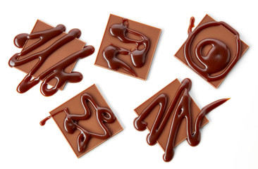 chocolate squares decorated with chocolate sauce
