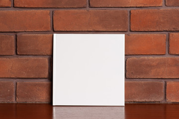 book near brick wall