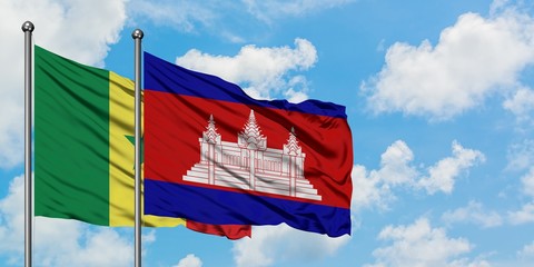 Senegal and Cambodia flag waving in the wind against white cloudy blue sky together. Diplomacy concept, international relations.