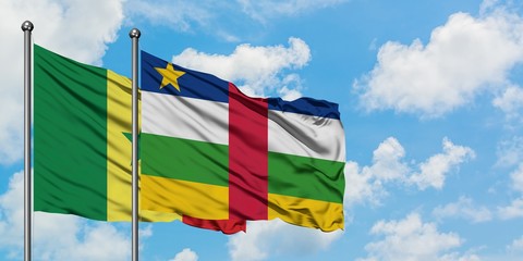 Senegal and Central African Republic flag waving in the wind against white cloudy blue sky together. Diplomacy concept, international relations.