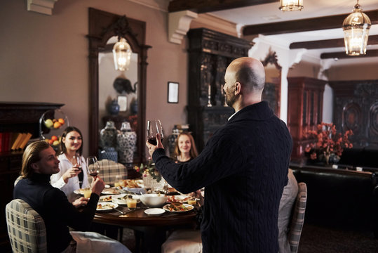 Listen to me please. Family friends having nice time in beautiful luxury modern restaurant