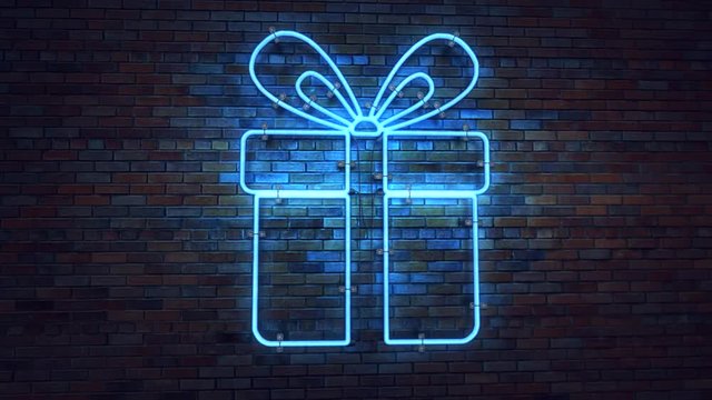 Bright neon sign with gift box on a brick wall. 