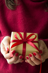 Woman with a present in her hands 