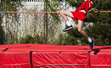 Boy high jumping outdoors