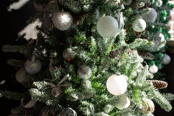 Obraz na płótnie Canvas Beautiful Christmas tree with festive decor on dark background. Space for text