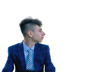 Portrait of a face in profile of a young man in a stylish blue suit isolated on a white background