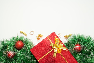 Christmas background for inscription, decorated with gift box with bow, garland. and Christmas...