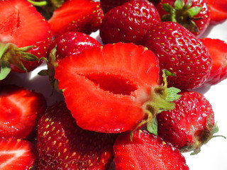 Strawberry close up whole and cut in half