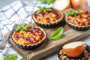 Homemade onion open mini pies.