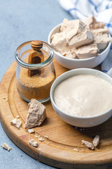 Different types of yeast on a wooden board.