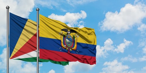 Seychelles and Ecuador flag waving in the wind against white cloudy blue sky together. Diplomacy concept, international relations.