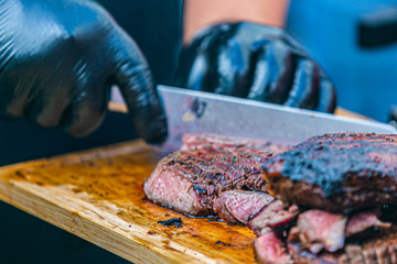 Close up hands of chef preparing food in the kitchen of a restaurant, cooking concept