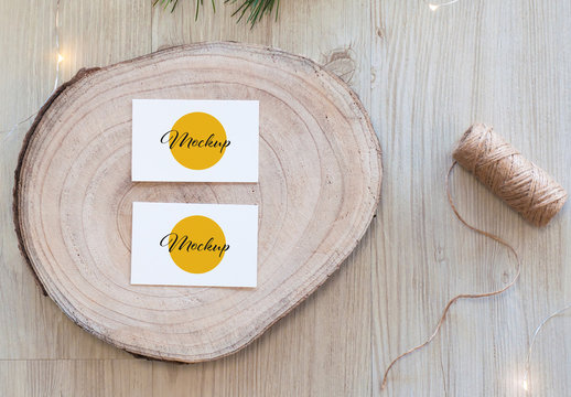 2 Horizontal White Business Card on Wood Slice Top View Mockup
