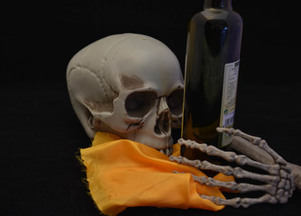 skull looking closely at the spanish oil bottle
