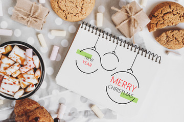 Winter or Christmas composition with hot cocoa, marshmallow, cookies and candy on white background. Christmas, winter, new year concept. Flat lay, top view, copy space