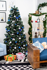 Christmas interior with Christmas tree and gifts.