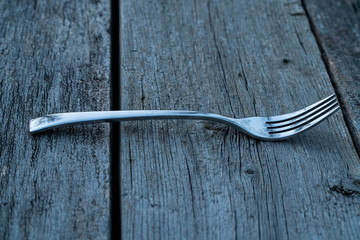 knife and fork on wooden background. Cutlery on wooden.