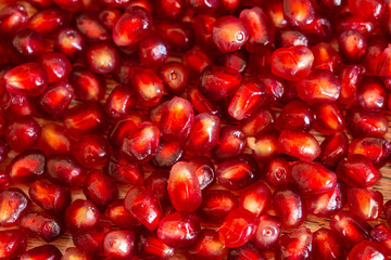 Pomegranate seeds close up background