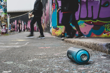 graffiti spray can on the ground