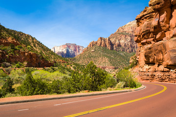 Road through the Zion National Park. Landscape of rock hills and trees. Utah, USA