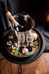 Holiday set. Champagne in a cooling bucket with glasses for couples in love.