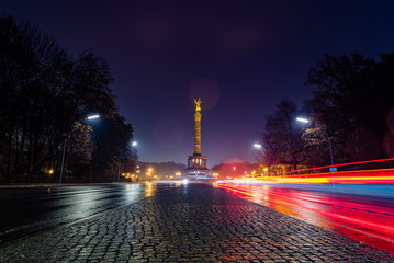 Victory column at night, Berlin at night, City at night, cars and blur motion, rainy Weather in berlin, Lens Flare, rains drops on lens, light trails - obrazy, fototapety, plakaty