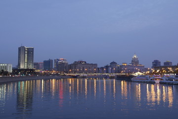 Moscow-City at sunset time: lights and reflections of city