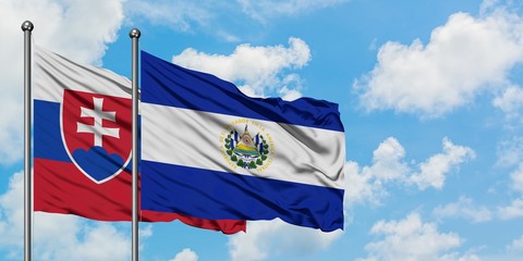 Slovakia and El Salvador flag waving in the wind against white cloudy blue sky together. Diplomacy concept, international relations. - obrazy, fototapety, plakaty