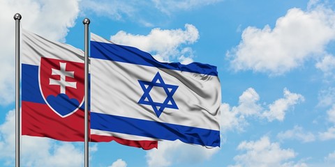 Slovakia and Israel flag waving in the wind against white cloudy blue sky together. Diplomacy concept, international relations.
