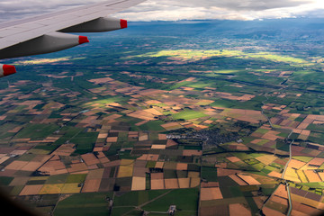 On landing approach, the first houses, streets and fields are to be seen