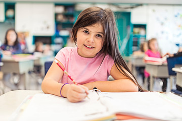 education and school concept little student girl studying at school