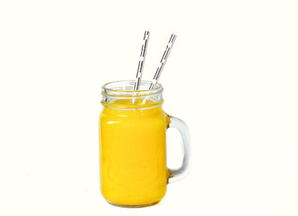 pineapple juice in a glass with a straw on a white background. Refreshing tasty healthy drink