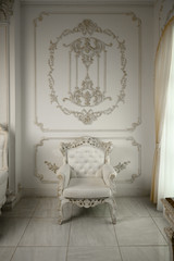 old armchair against a vintage wall