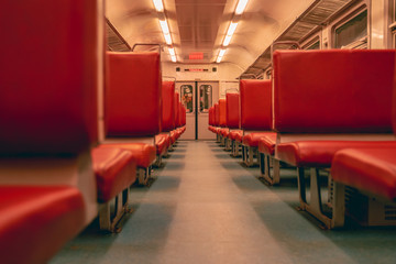 Vintage interior with red chairs in old suburban electric train in Riga, Latvia