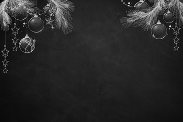 Christmas Sparkling Balls and Stars on black Chalkboard with pine tree branches - obrazy, fototapety, plakaty